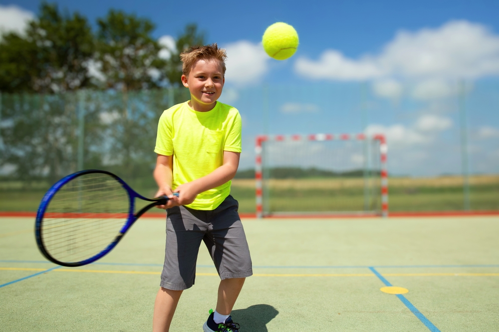 Boy,playing,tennis,at,the,court,,happy,healthy,kid,doing